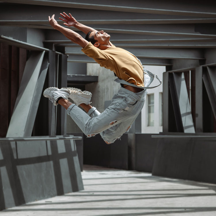 Man Dancing on Walkway Man Dancing on Walkway